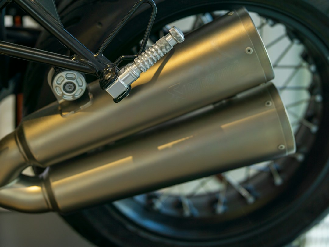 Motorcycle exhaust pipes are prominently displayed